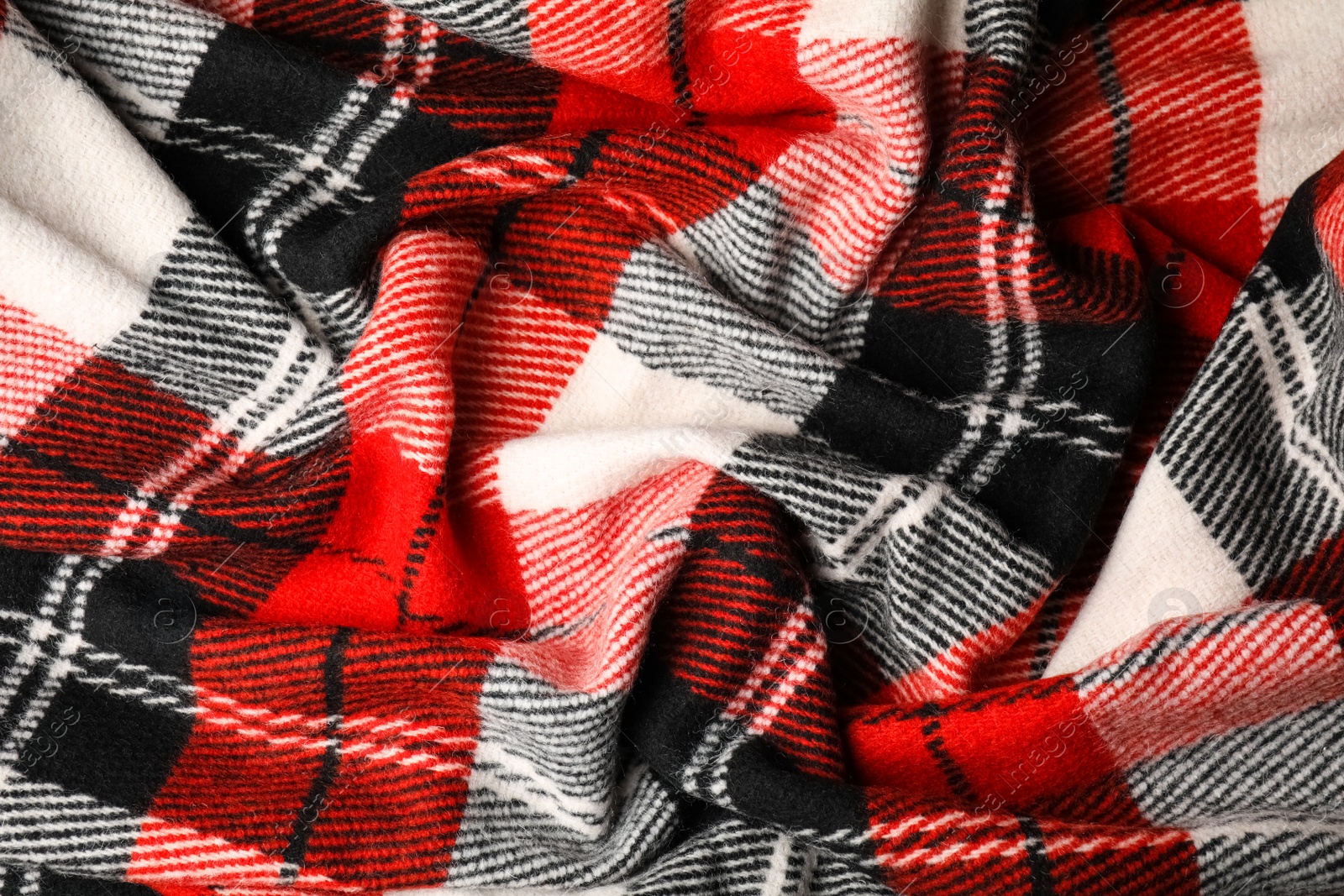 Photo of Soft crumpled checkered plaid as background, closeup