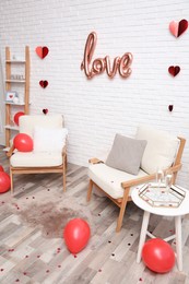 Photo of Cozy living room decorated for Valentine Day. Interior design