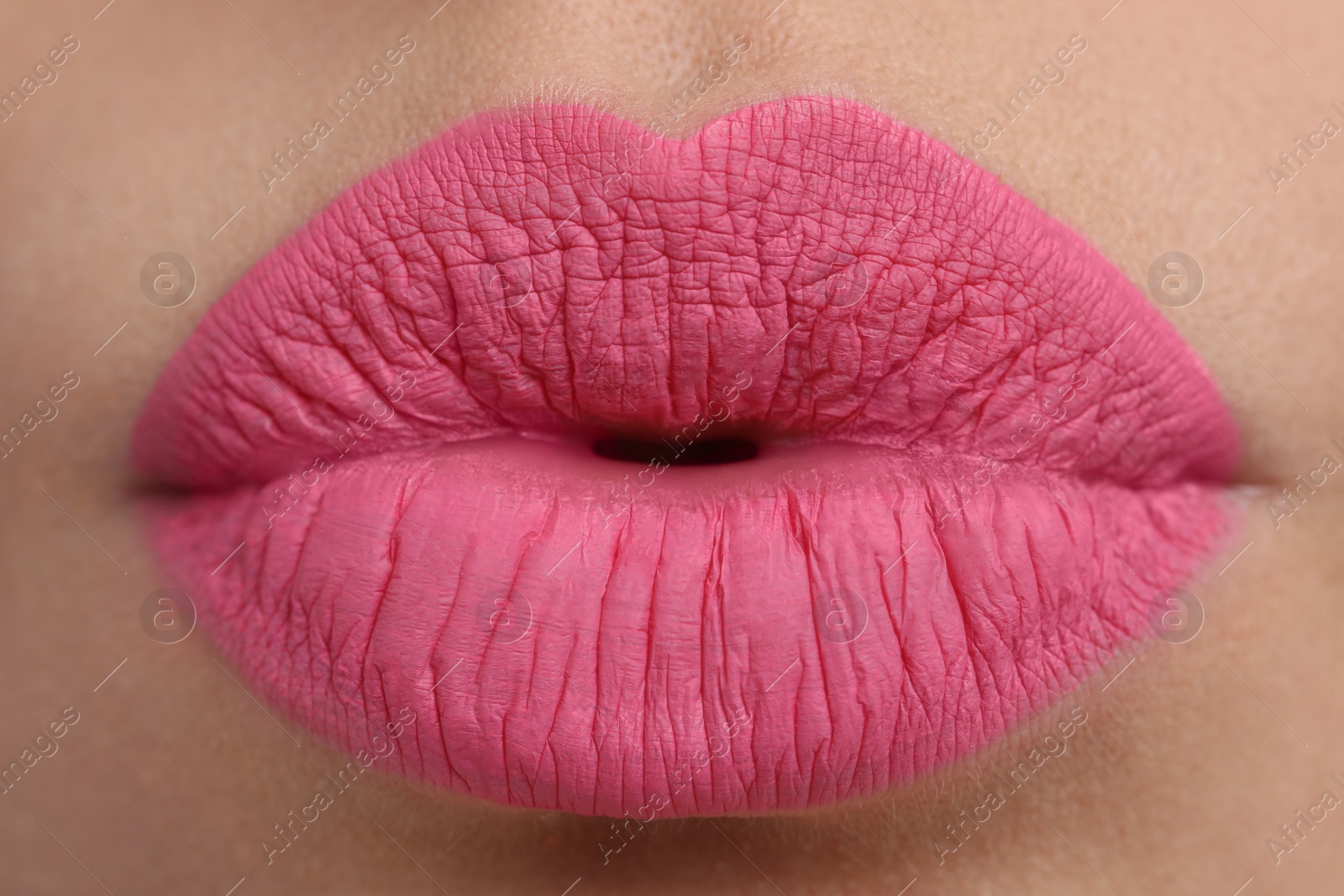 Photo of Closeup view of beautiful woman puckering lips for kiss