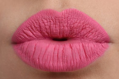 Photo of Closeup view of beautiful woman puckering lips for kiss