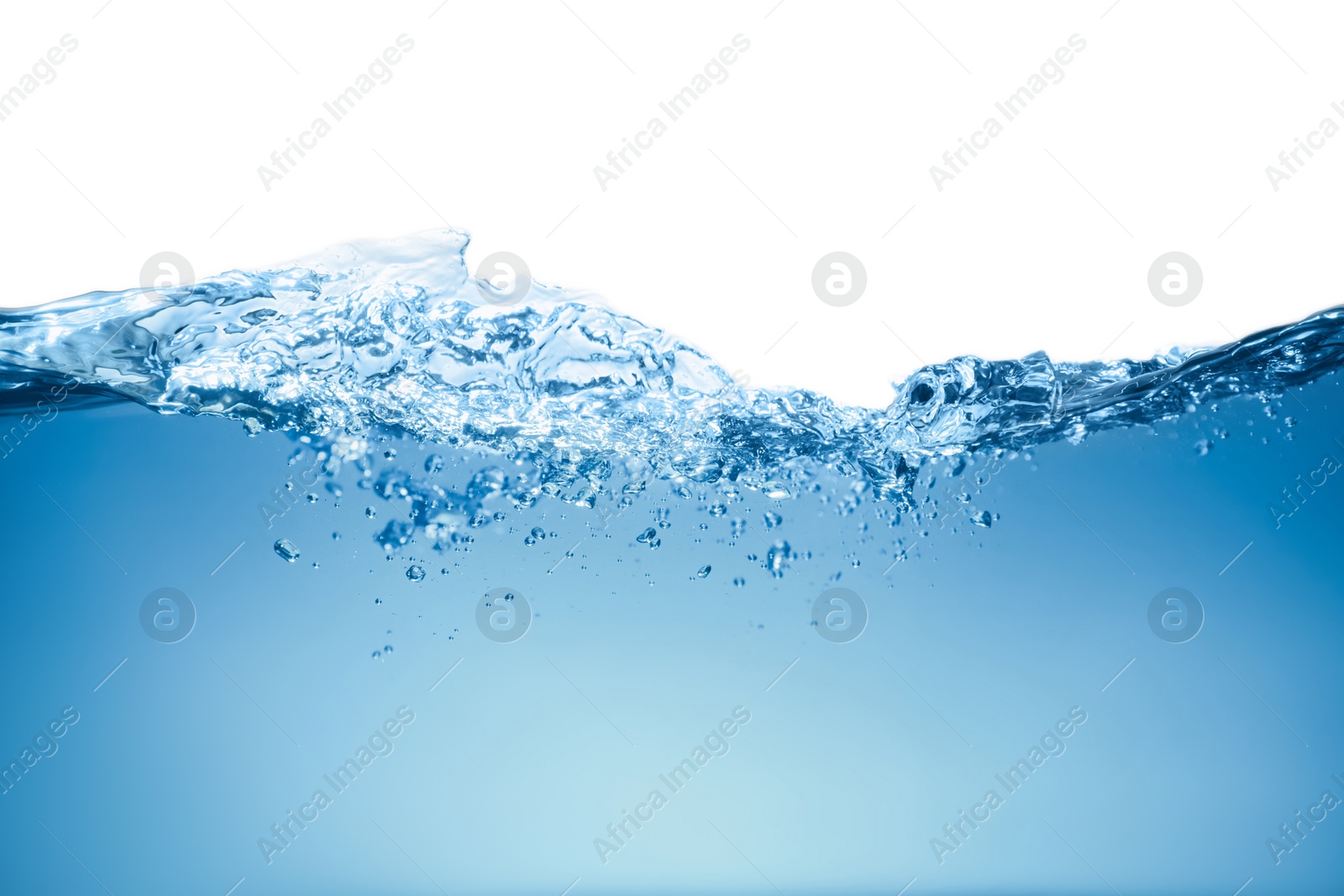 Photo of Splash of clear blue water on white background