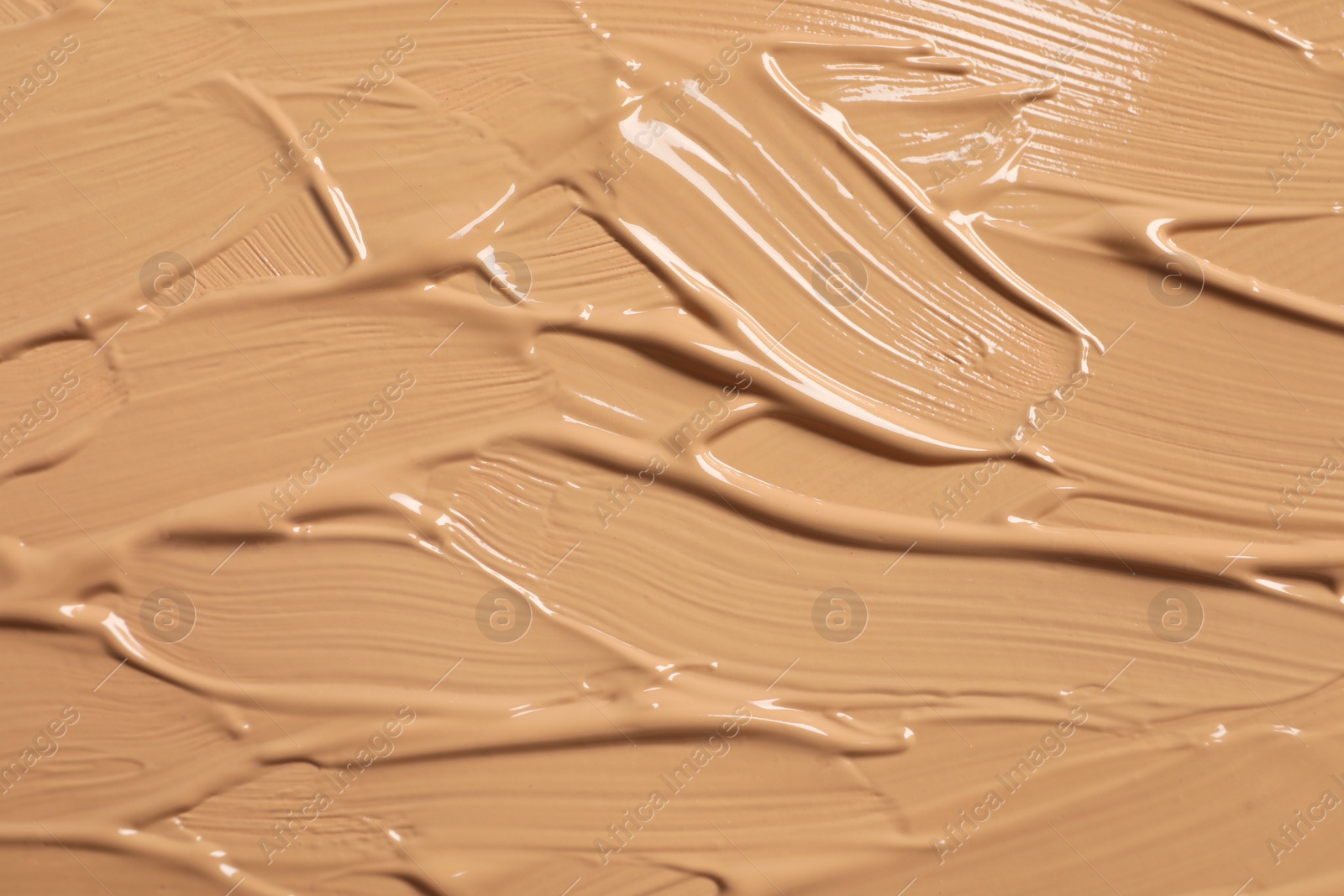 Photo of Texture of skin foundation as background, closeup