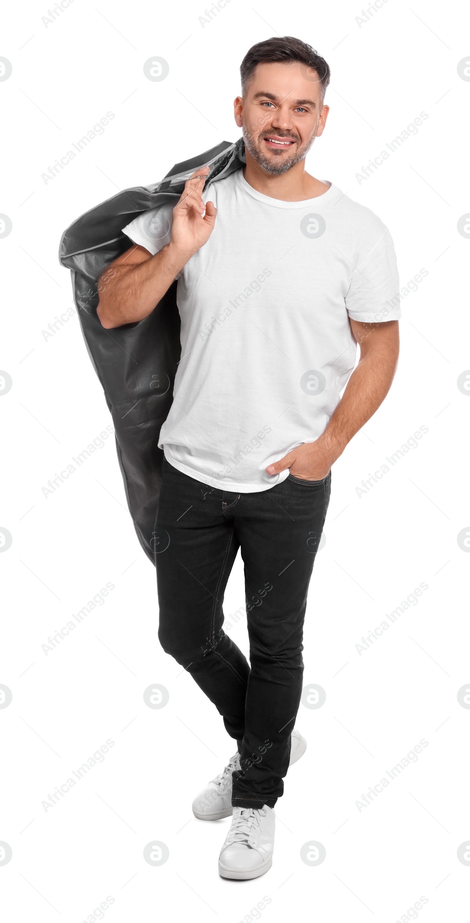 Photo of Man holding garment cover with clothes on white background. Dry-cleaning service