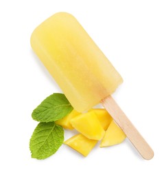 Photo of Tasty mango ice pop isolated on white, top view. Fruit popsicle