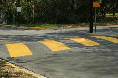 Photo of Speed bump on empty street. Road rules