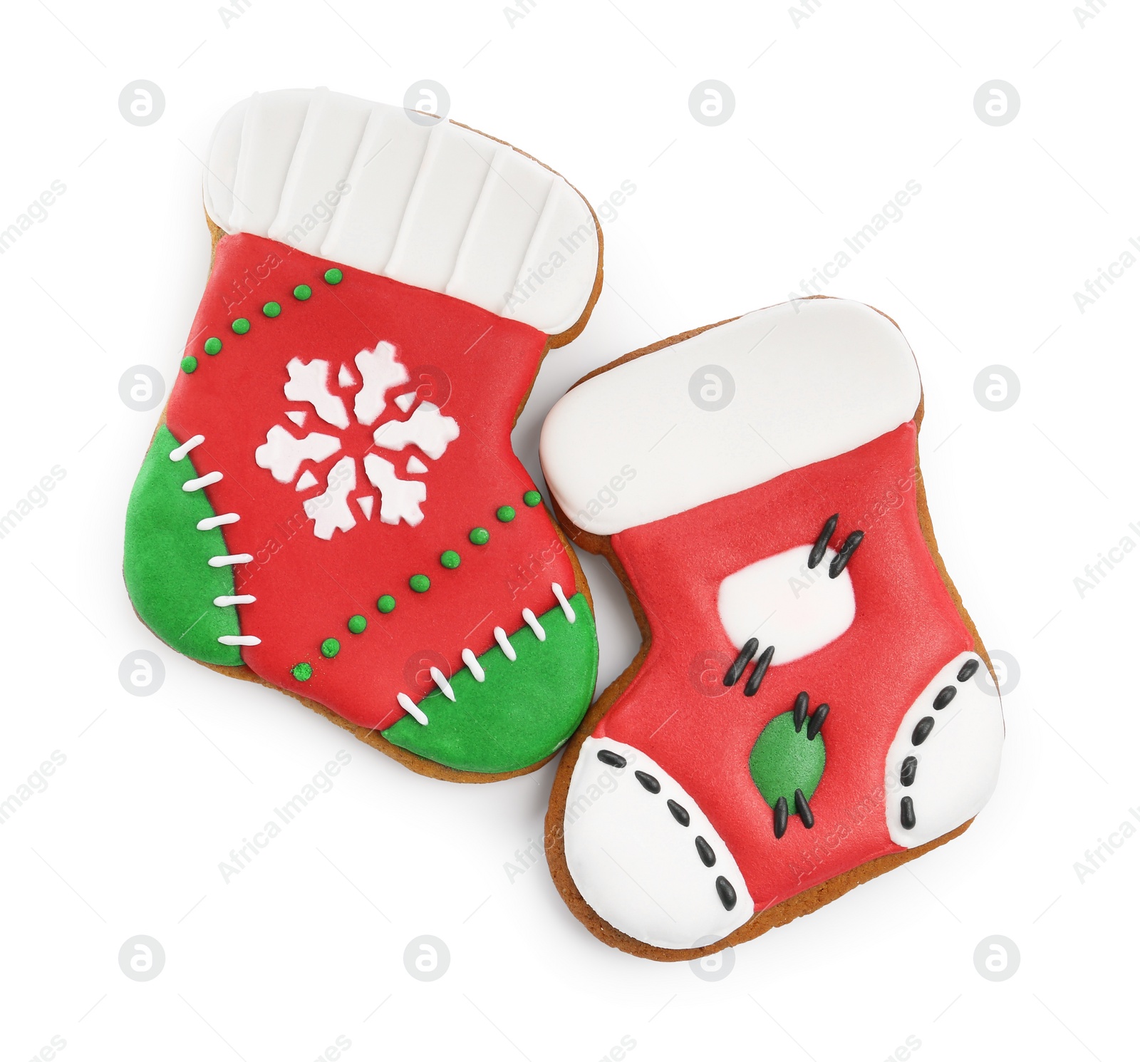 Photo of Delicious cookies in shape of Christmas stockings isolated on white, top view