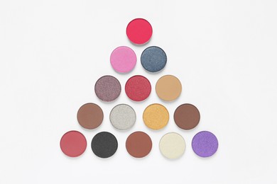 Different beautiful eye shadows on white background, flat lay