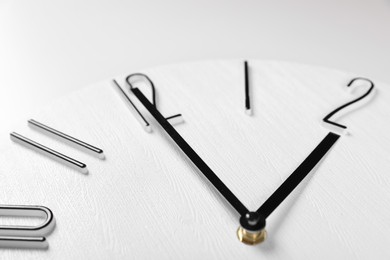 Stylish analog clock on white background, closeup