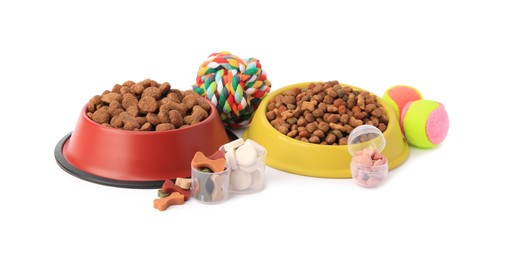 Photo of Dry pet food, vitamins and toys isolated on white