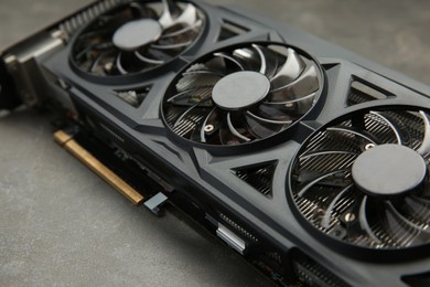Photo of One graphics card on grey table, closeup