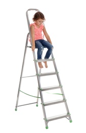 Photo of Little girl climbing up ladder on white background. Danger at home