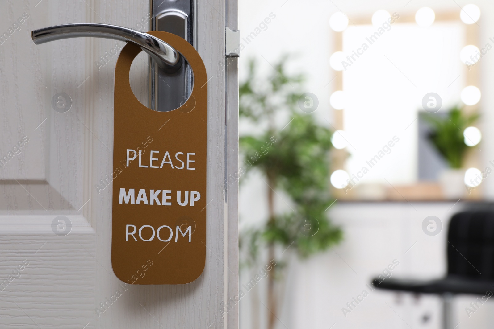 Photo of Open door with sign PLEASE MAKE UP ROOM on handle at hotel, space for text