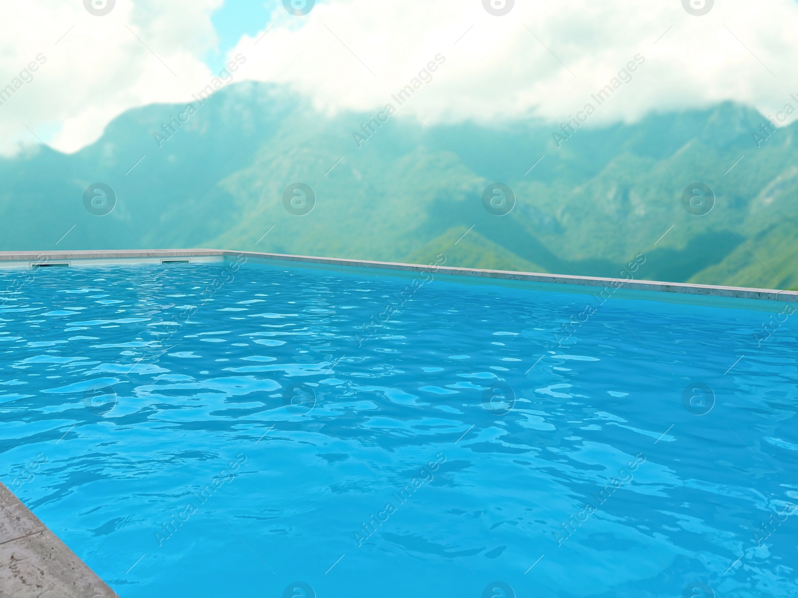 Image of Outdoor swimming pool at luxury resort with beautiful view of mountains