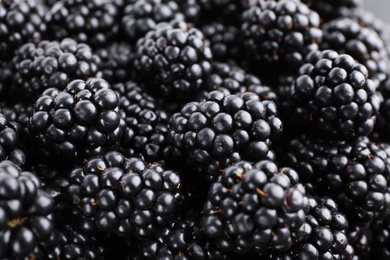 Photo of Tasty ripe blackberries as background, closeup view