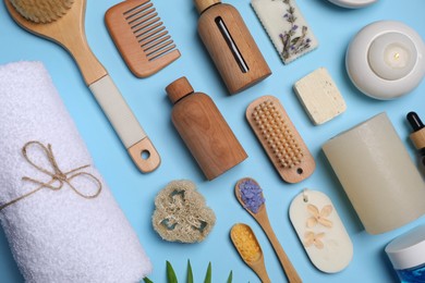 Photo of Flat lay composition with different spa products on light blue background