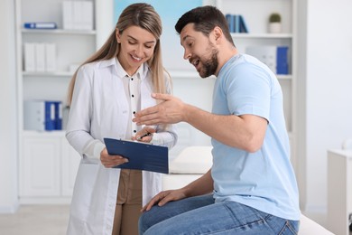 Photo of Professional doctor working with patient in hospital