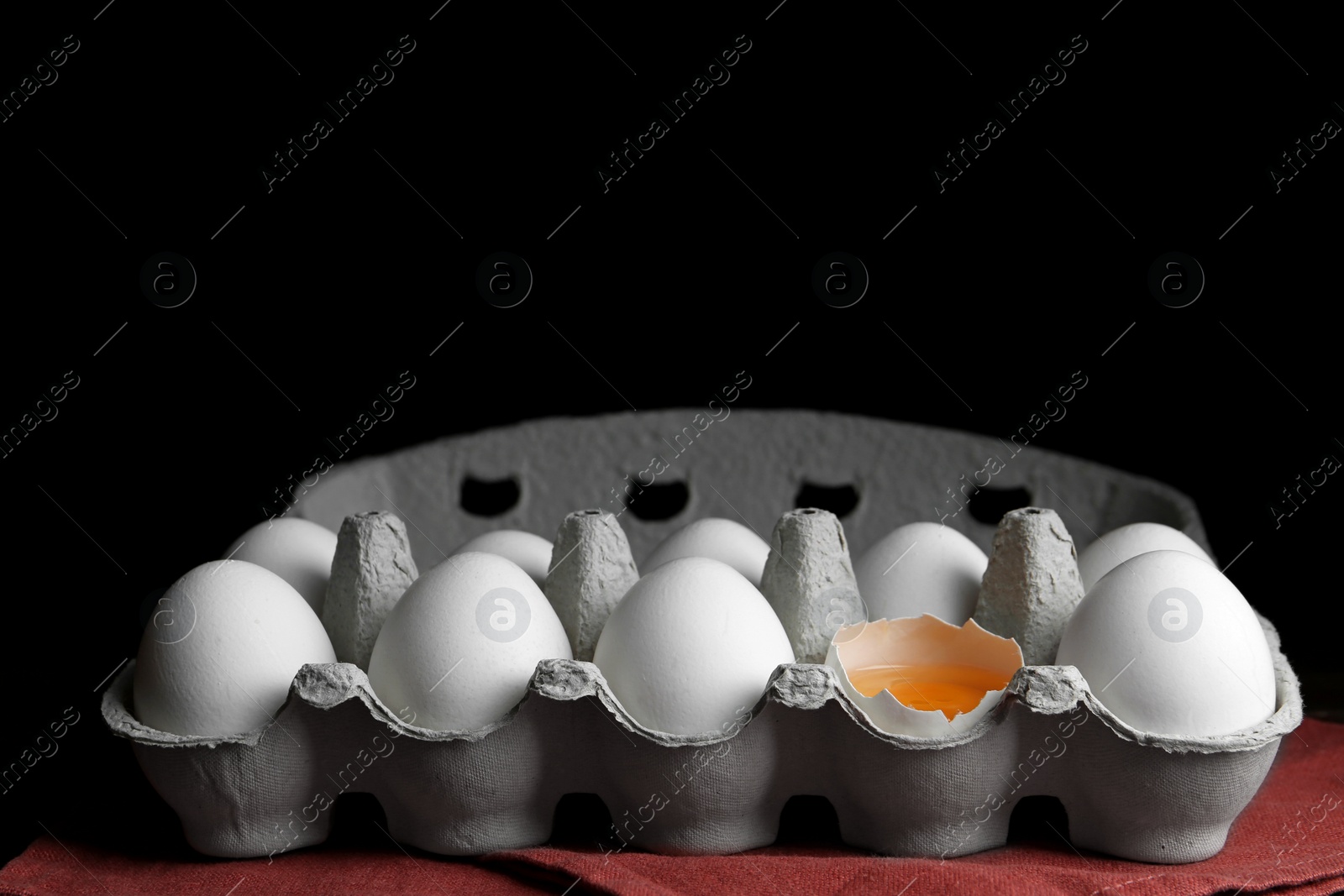 Photo of Fresh raw chicken eggs in box on table. Space for text