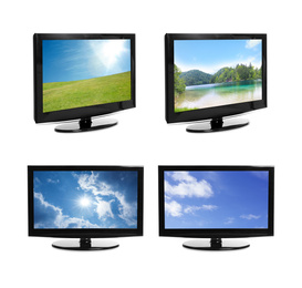 Image of Set of modern plasma TVs with landscape on screens against white background