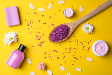 Photo of Flat lay composition with body care products on color background