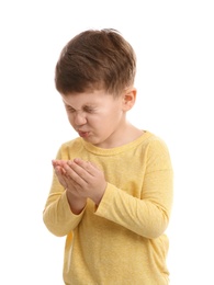 Cute boy suffering from cold on white background