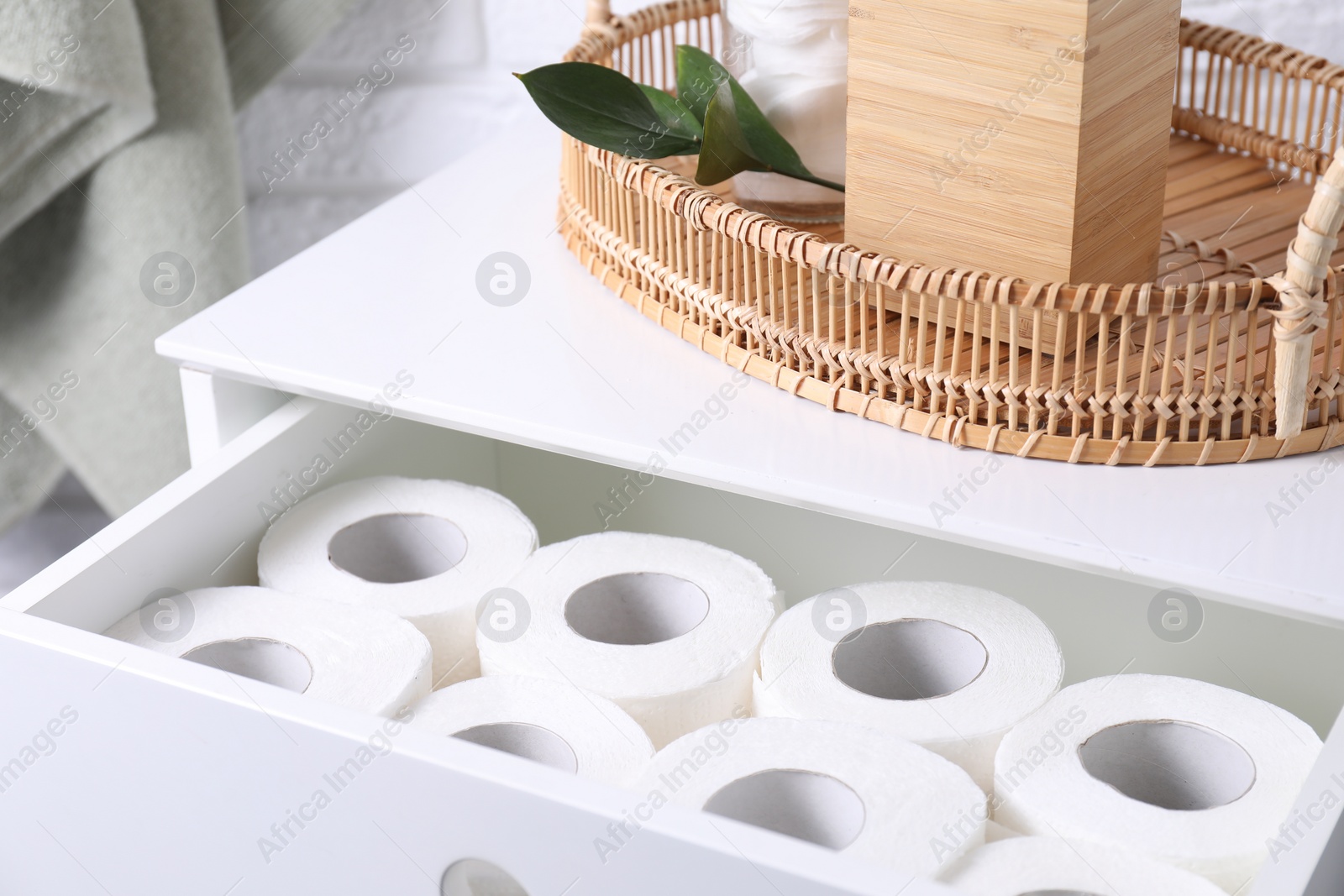 Photo of Many toilet paper rolls in white drawer indoors