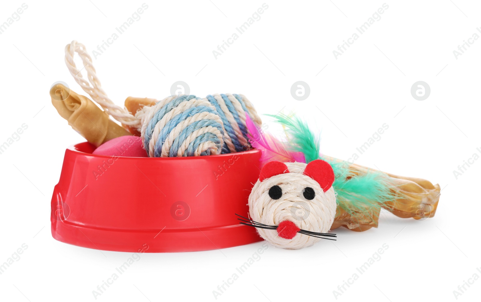 Photo of Pet toys, bowl and dog treat isolated on white