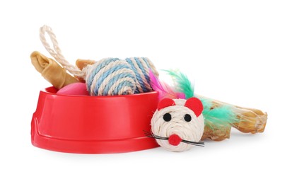 Photo of Pet toys, bowl and dog treat isolated on white