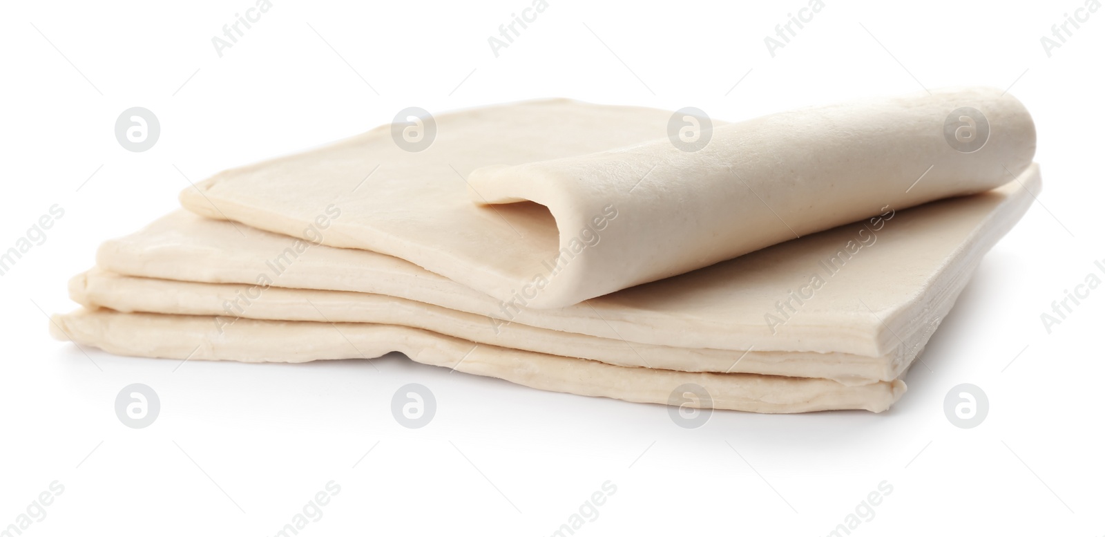 Photo of Fresh raw dough on white background