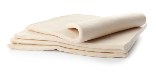 Photo of Fresh raw dough on white background