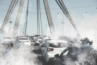 Image of Environmental pollution. Air contaminated with fumes in city. Cars surrounded by exhaust on road