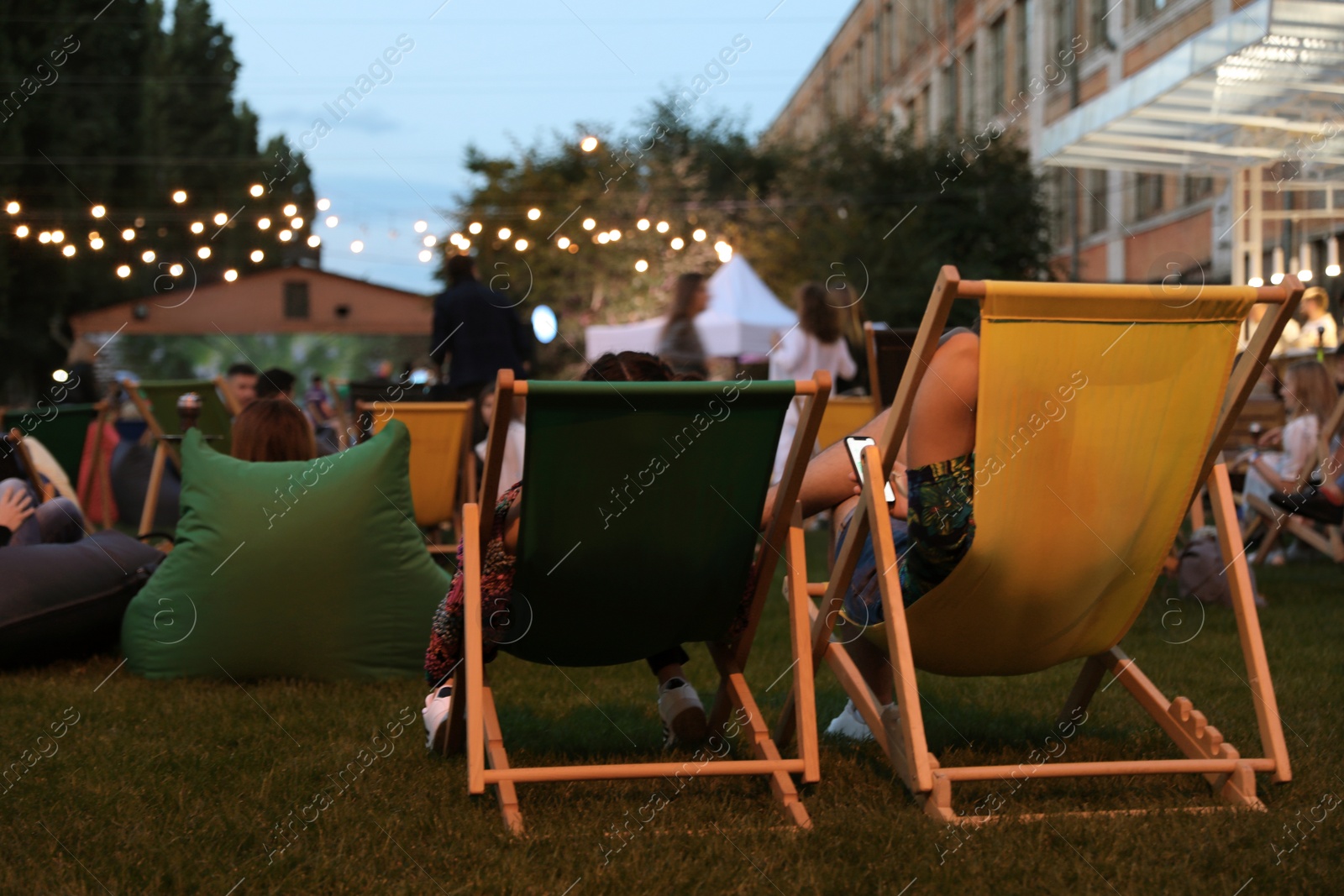 Photo of Modern open air cinema with comfortable seats in public park