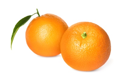 Photo of Fresh ripe oranges with green leaf on white background