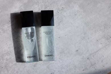 Leiden, Netherlands - July 14, 2022: Chanel cosmetic products on light grey table, flat lay. Space for text