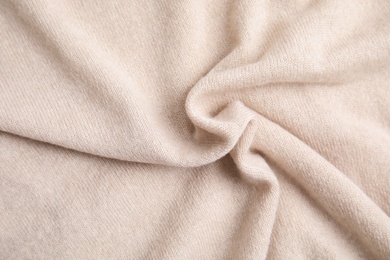 Photo of Warm cashmere sweater as background, top view