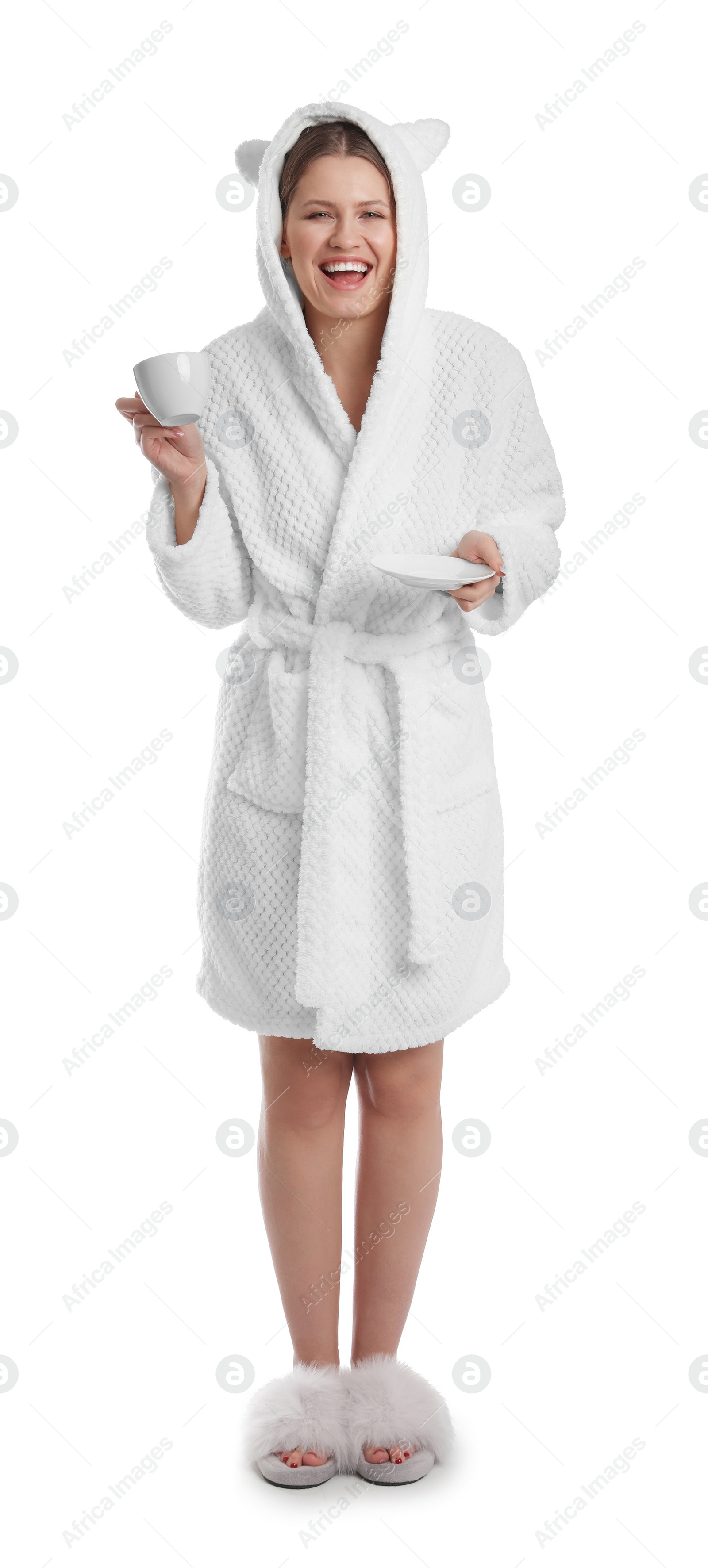 Photo of Young woman in bathrobe with cup of beverage on white background