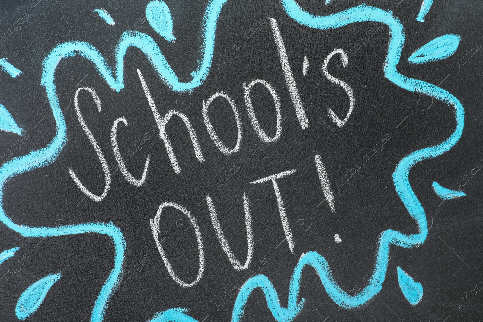 Photo of Text School's Out written on black chalkboard. Summer holidays