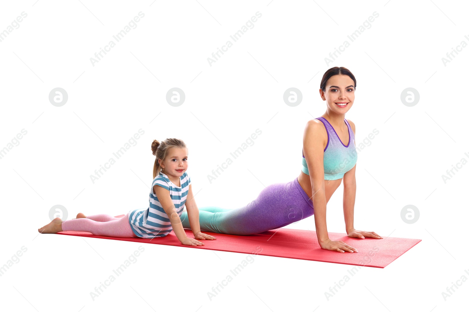 Photo of Woman and daughter doing yoga together on white background. Home fitness