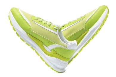 Pair of stylish light green sneakers on white background