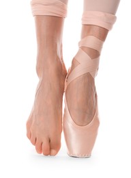 Photo of Ballerina in pointe shoe dancing on white background, closeup