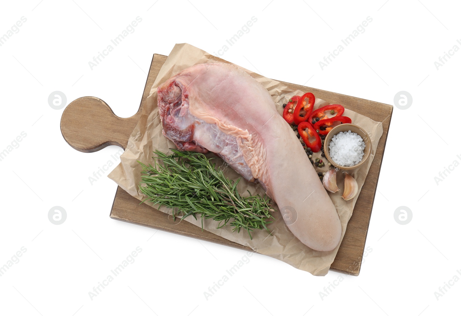 Photo of Board with raw beef tongue and products on white background, top view