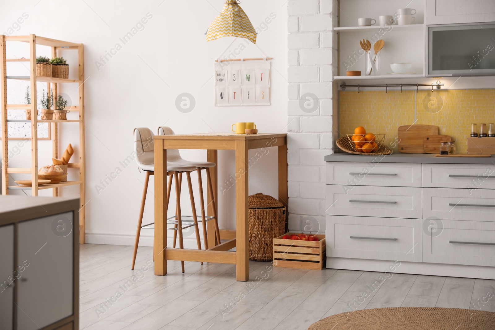 Photo of Modern kitchen interior with stylish wooden table