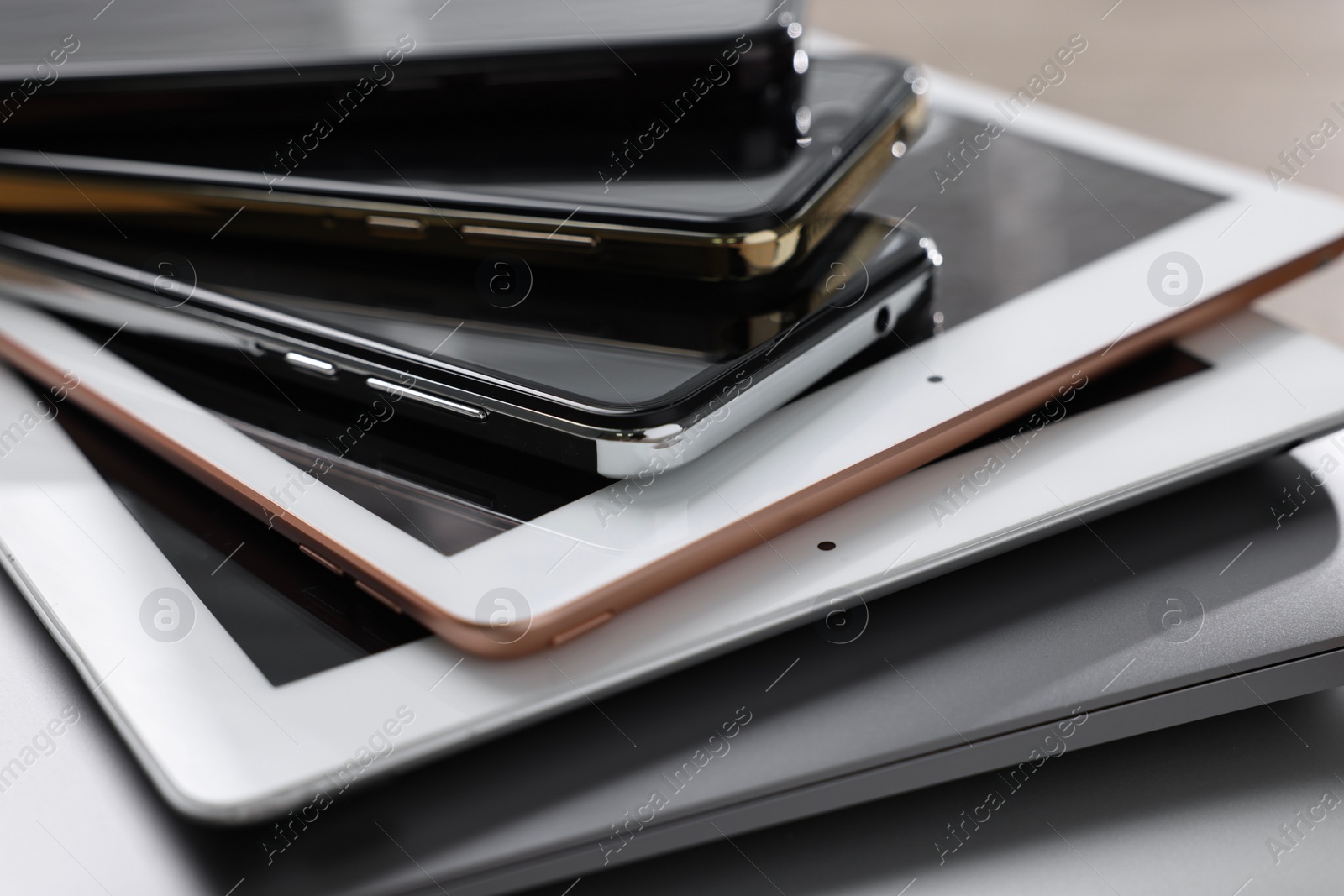 Photo of Many different modern gadgets on table, closeup