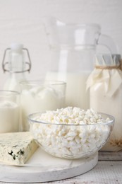 Different fresh dairy products on white wooden table