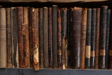 Collection of different library books on shelf, closeup