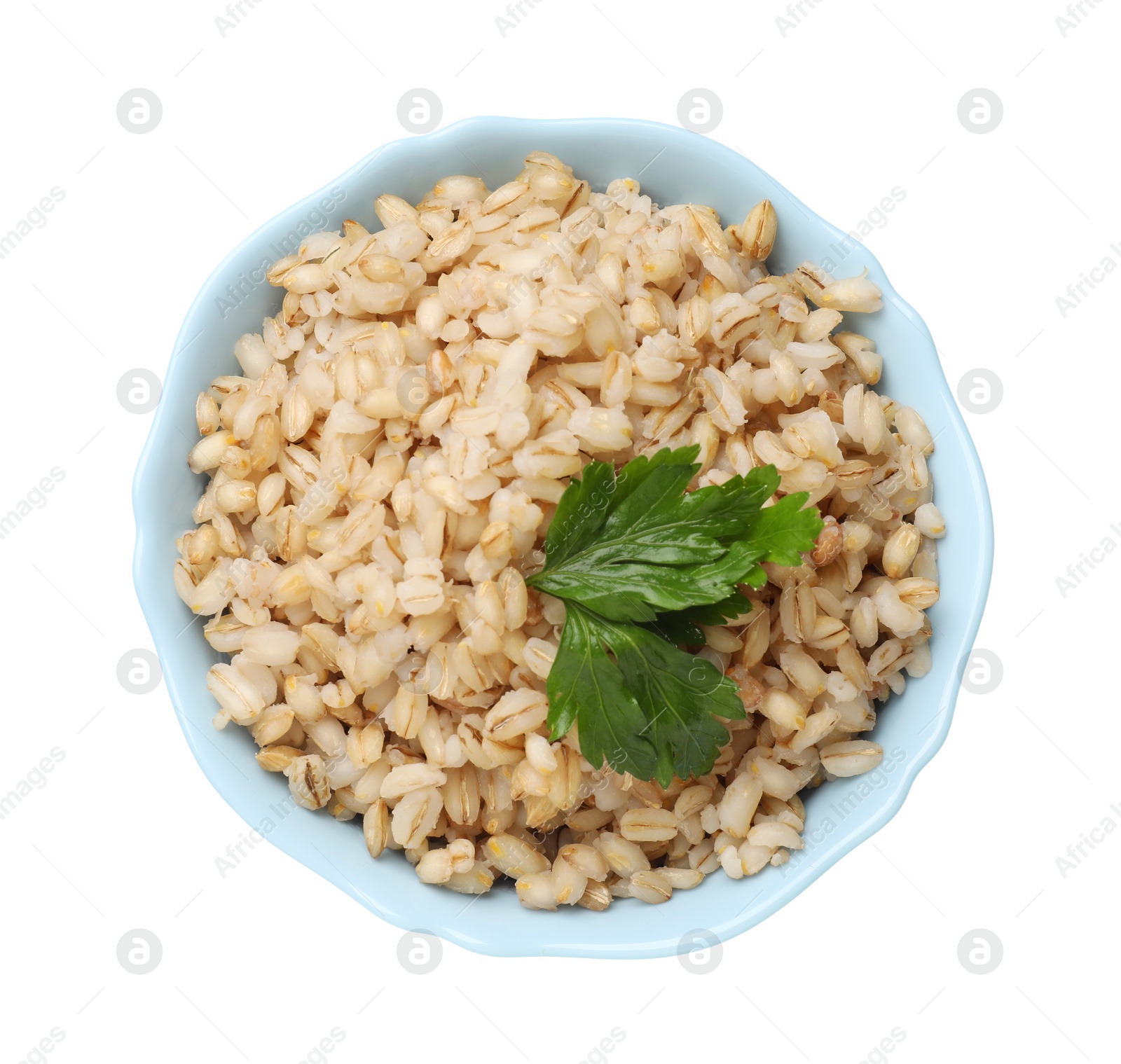 Photo of Delicious pearl barley with parsley in bowl isolated on white, top view