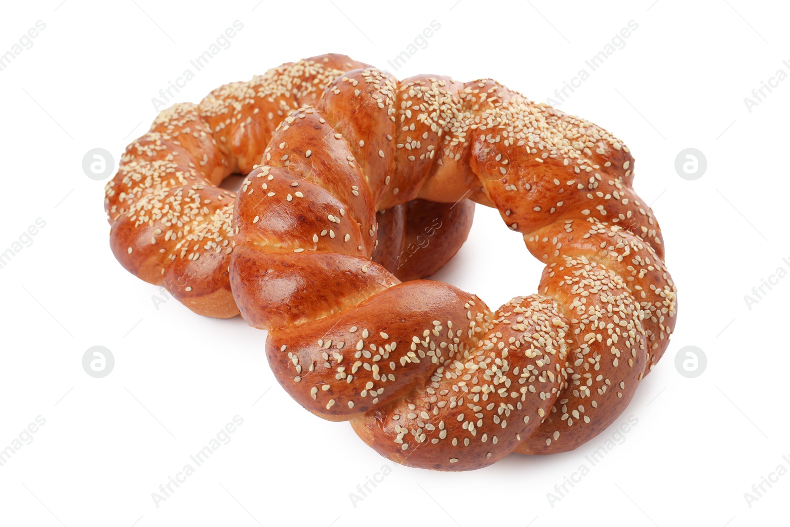 Photo of Round braided breads isolated on white. Fresh pastries