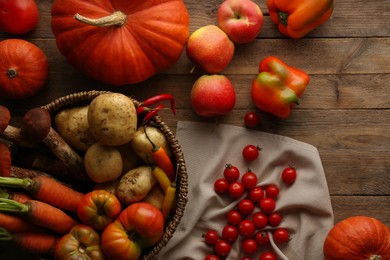 Different fresh ripe vegetables and fruits on wooden table, flat lay