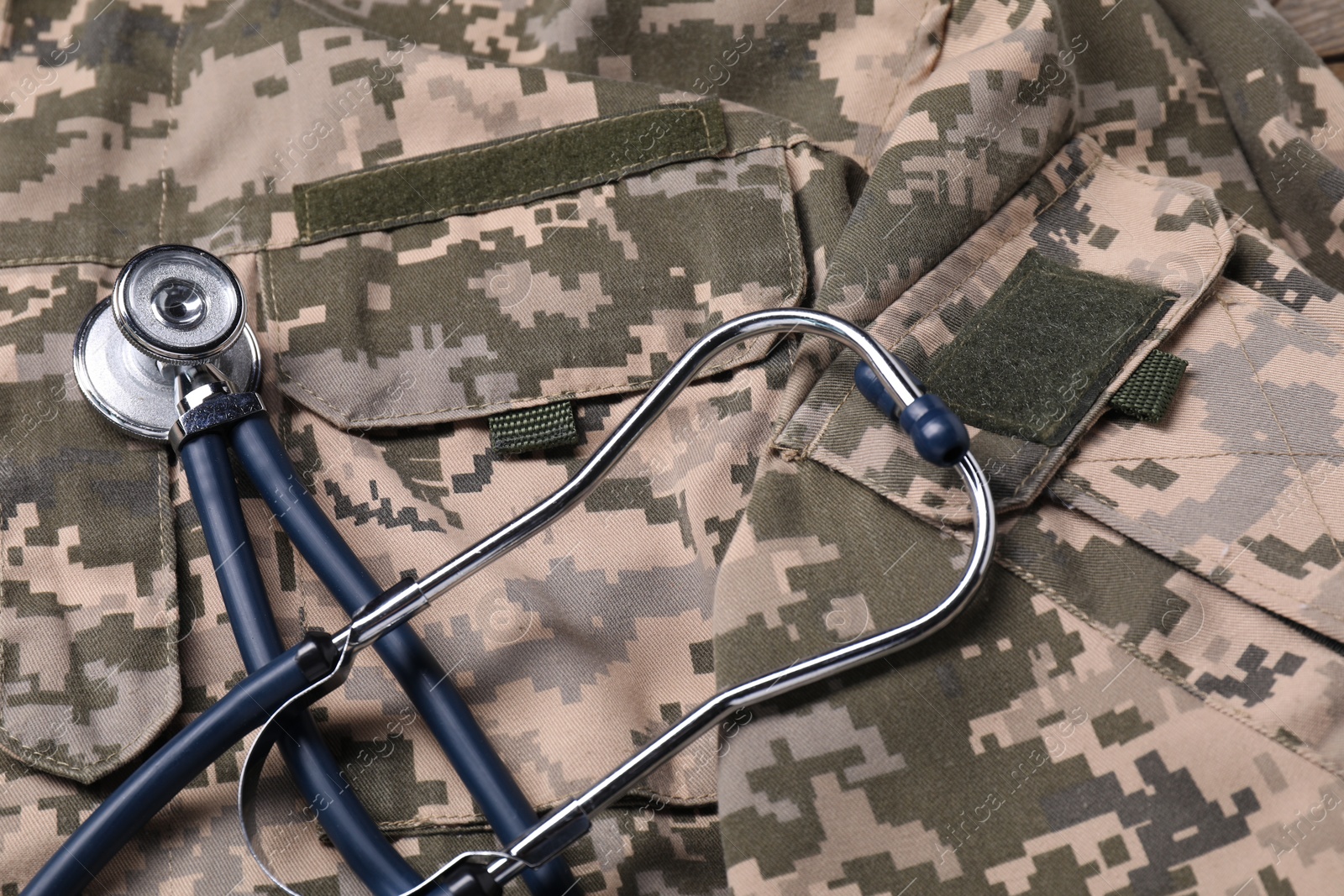 Photo of Medical stethoscope on soldier uniform. Military service