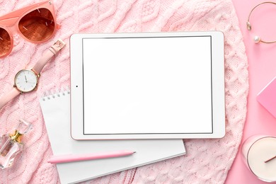 Photo of Flat lay composition with modern tablet on pink background. Space for text