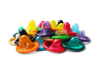 Photo of Pile of colorful condoms on white background. Safe sex